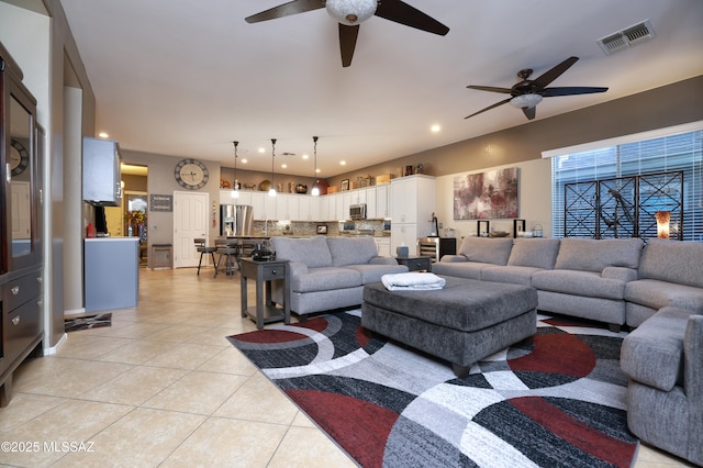 tiled living room featuring a healthy amount of sunlight