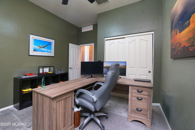 home office with ceiling fan and light colored carpet