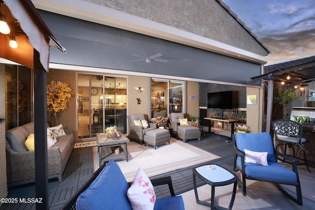 view of patio / terrace featuring outdoor lounge area and ceiling fan