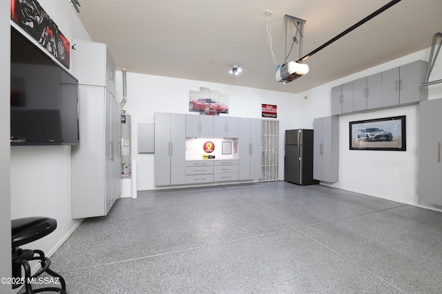 garage featuring stainless steel refrigerator, a garage door opener, and water heater