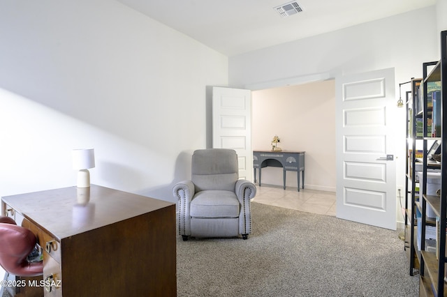 living area with light colored carpet