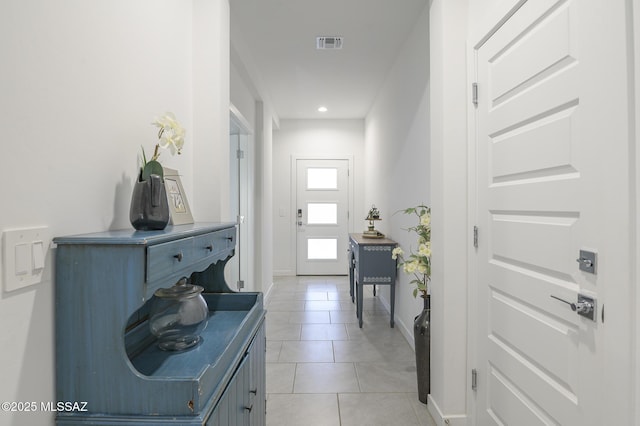 entryway featuring light tile patterned floors