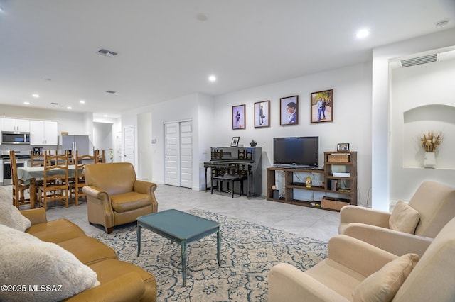 living room with light tile patterned floors