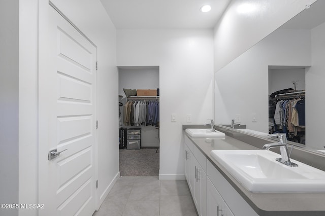 bathroom with tile patterned floors and vanity