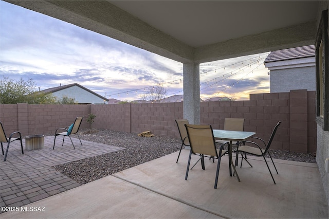 view of patio terrace at dusk