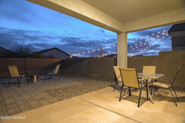 view of patio terrace at dusk