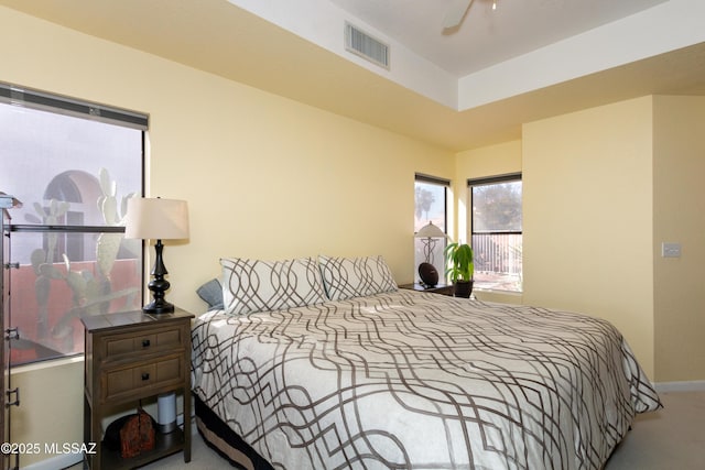 bedroom featuring light carpet