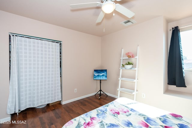 bedroom featuring ceiling fan and dark hardwood / wood-style flooring