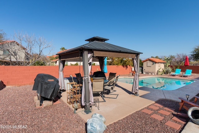 view of pool featuring a gazebo, a grill, and a patio area