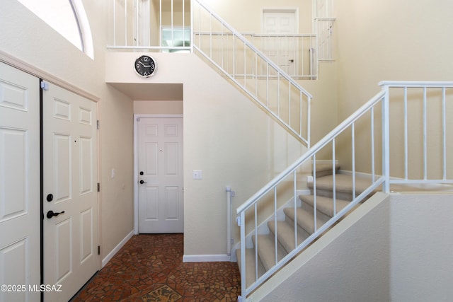 foyer with a towering ceiling