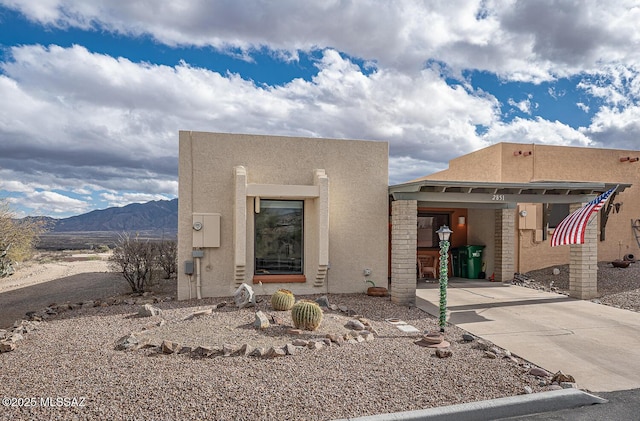 adobe home with a mountain view