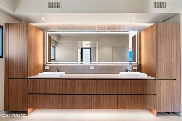 bathroom featuring vanity and tile patterned flooring