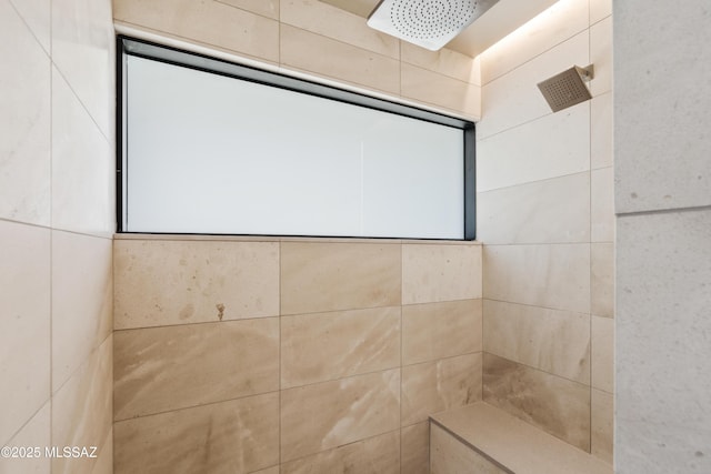 bathroom with tiled shower