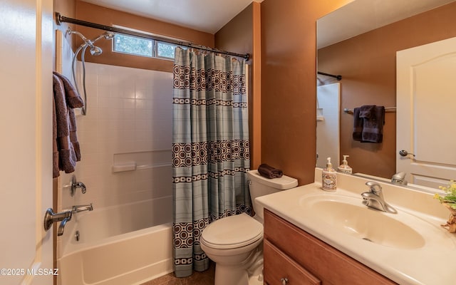 full bathroom with vanity, shower / tub combo with curtain, and toilet