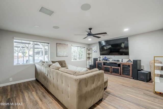 living room with hardwood / wood-style floors and ceiling fan