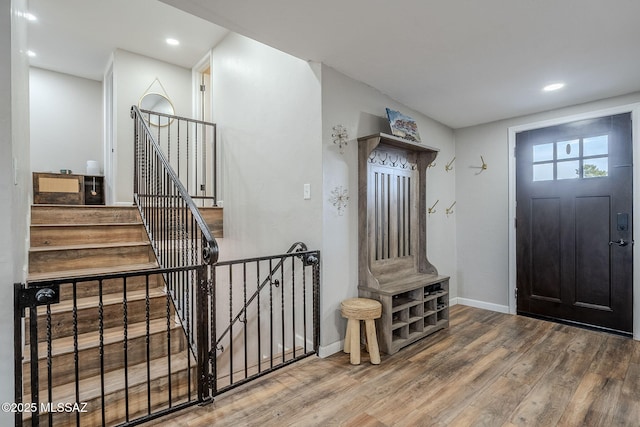 foyer entrance with hardwood / wood-style flooring