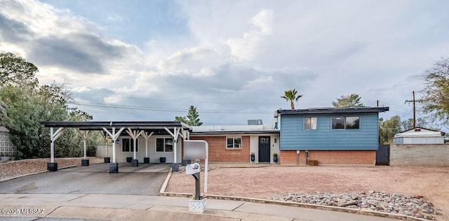 view of front of property with a carport