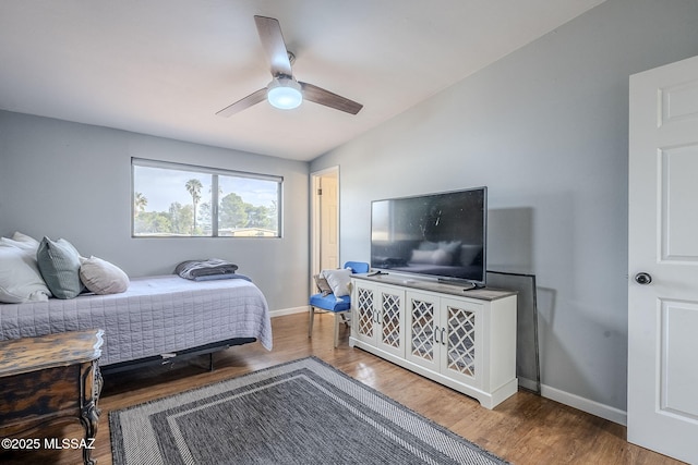 bedroom featuring hardwood / wood-style flooring and ceiling fan