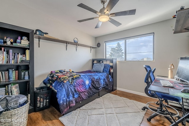 bedroom featuring ceiling fan and light hardwood / wood-style flooring