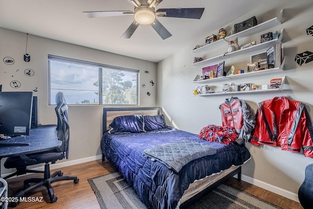 bedroom with hardwood / wood-style flooring and ceiling fan