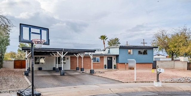 view of front of home with a carport