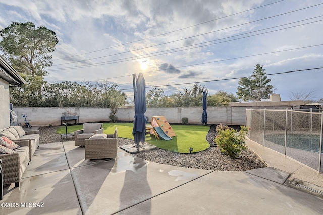 view of patio / terrace featuring a playground and an outdoor hangout area