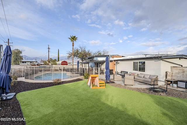 exterior space with an outdoor living space, a patio area, and a fenced in pool