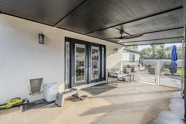 view of patio / terrace with french doors and ceiling fan