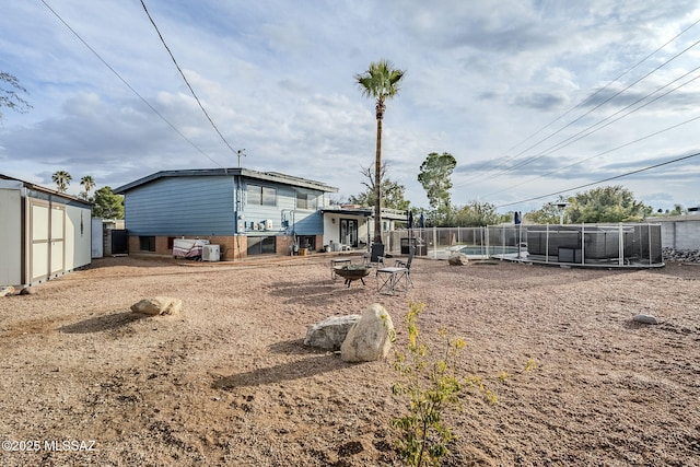 view of yard featuring an outdoor fire pit