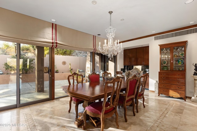 dining space with an inviting chandelier