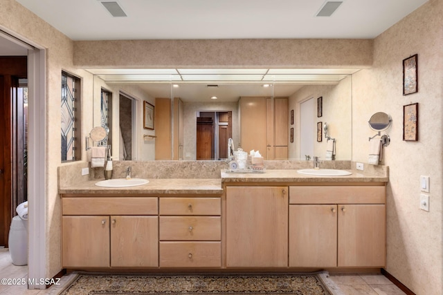 bathroom with vanity and tile patterned floors