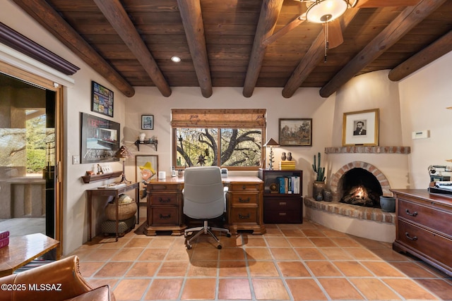 office space with beam ceiling, wood ceiling, and a fireplace