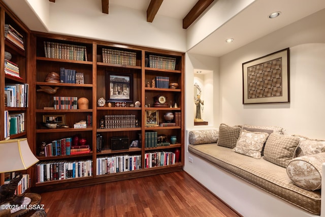 living area with hardwood / wood-style flooring and beamed ceiling