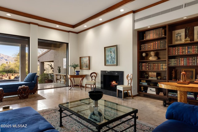 sitting room with built in shelves and light tile patterned flooring