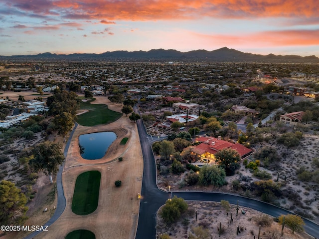 aerial view at dusk with a mountain view