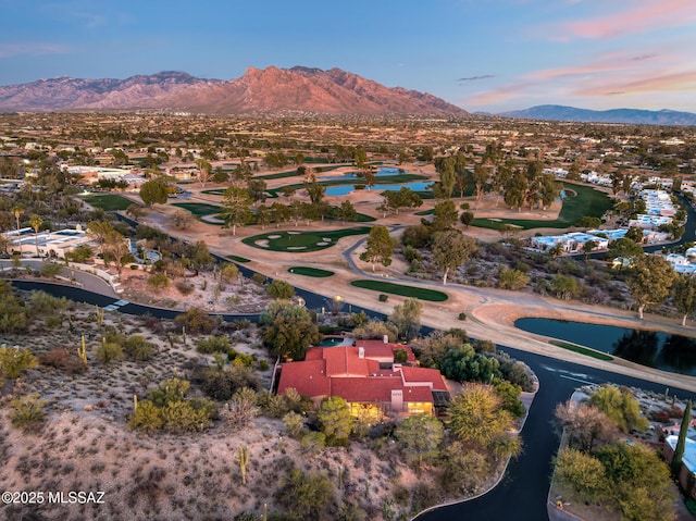 aerial view at dusk with a water and mountain view