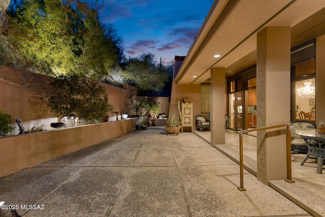 view of patio terrace at dusk