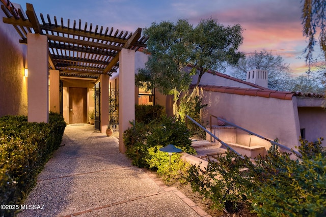 exterior space with a pergola and a patio area