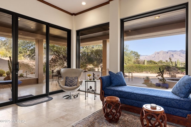 sunroom / solarium with a mountain view and a healthy amount of sunlight