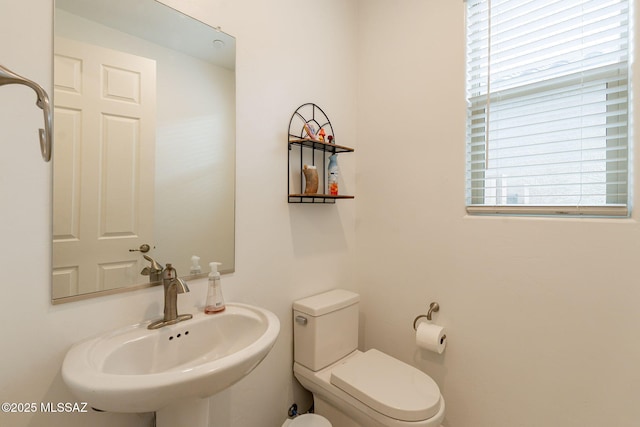 bathroom with toilet and sink