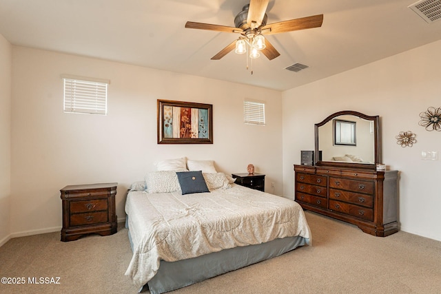 bedroom with light carpet and ceiling fan