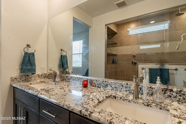 bathroom with plenty of natural light and vanity