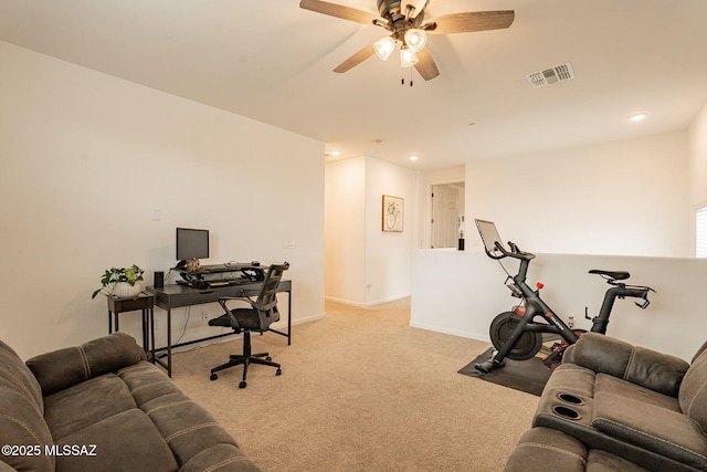 home office featuring light colored carpet and ceiling fan