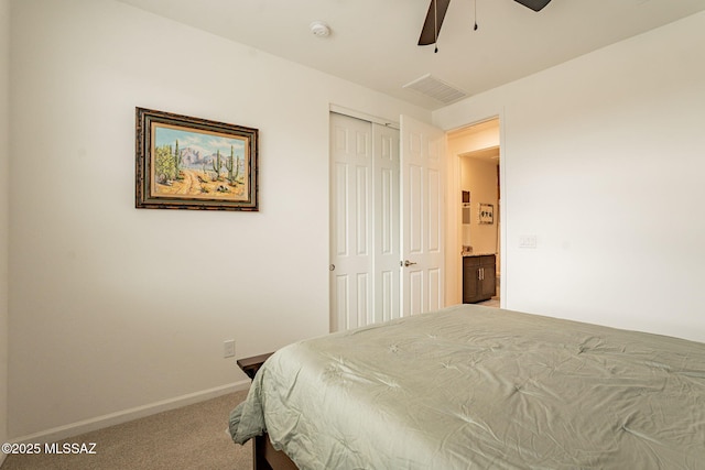 bedroom featuring carpet flooring, ceiling fan, and a closet