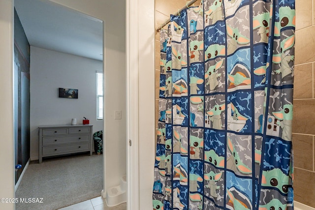 bathroom featuring tile patterned floors and walk in shower