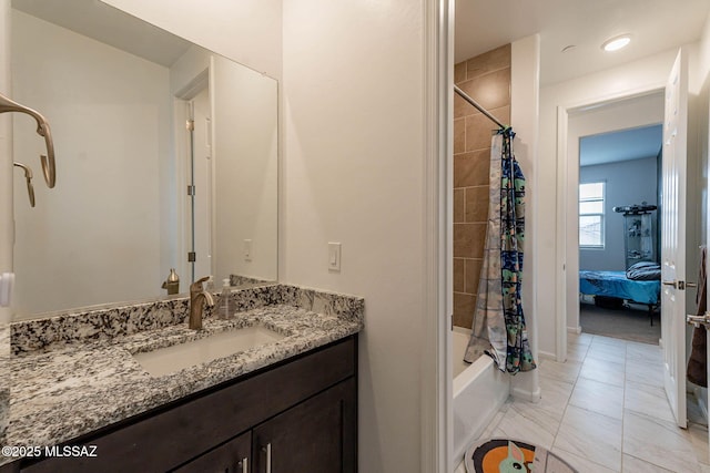 bathroom featuring vanity and shower / tub combo with curtain