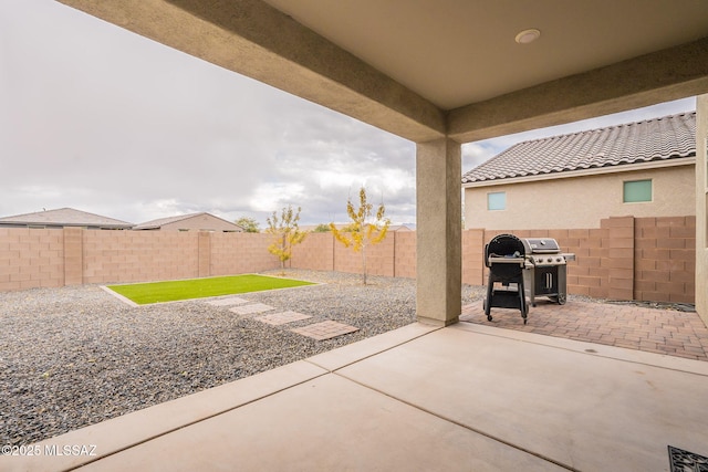 view of patio with a grill