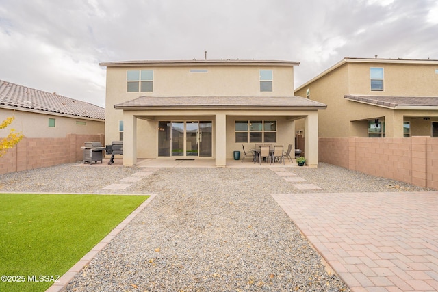 rear view of property with a patio