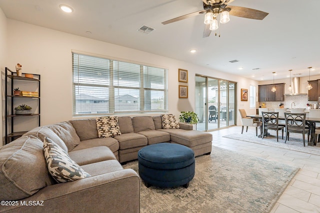 living room with ceiling fan