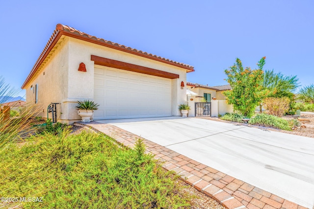 mediterranean / spanish house featuring a garage